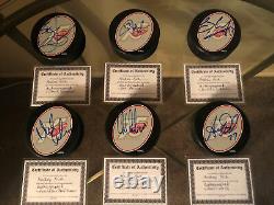 30 Autographed COA Hockey Puck With Display Case Ilitch-Yzerman 75th Anniversary
