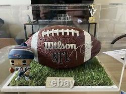 Genuine hand signed Tom Brady NFL ball with engraved display case and COA