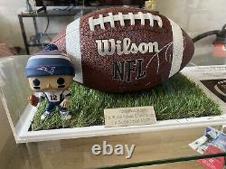 Genuine hand signed Tom Brady NFL ball with engraved display case and COA